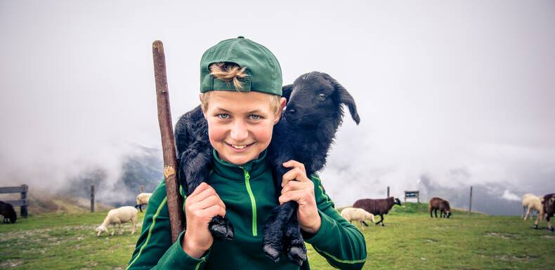 Young shepherd with lamb | © Edith Danzer